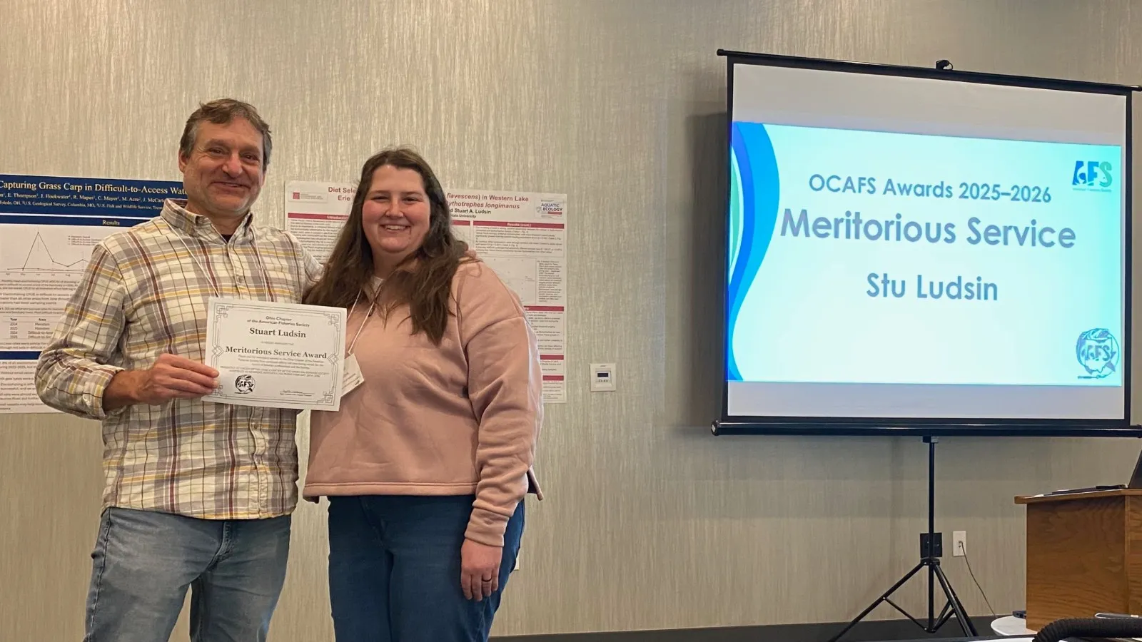 Stuart Ludsin with Taylor Hunkins presenting his Meritorious Service Award