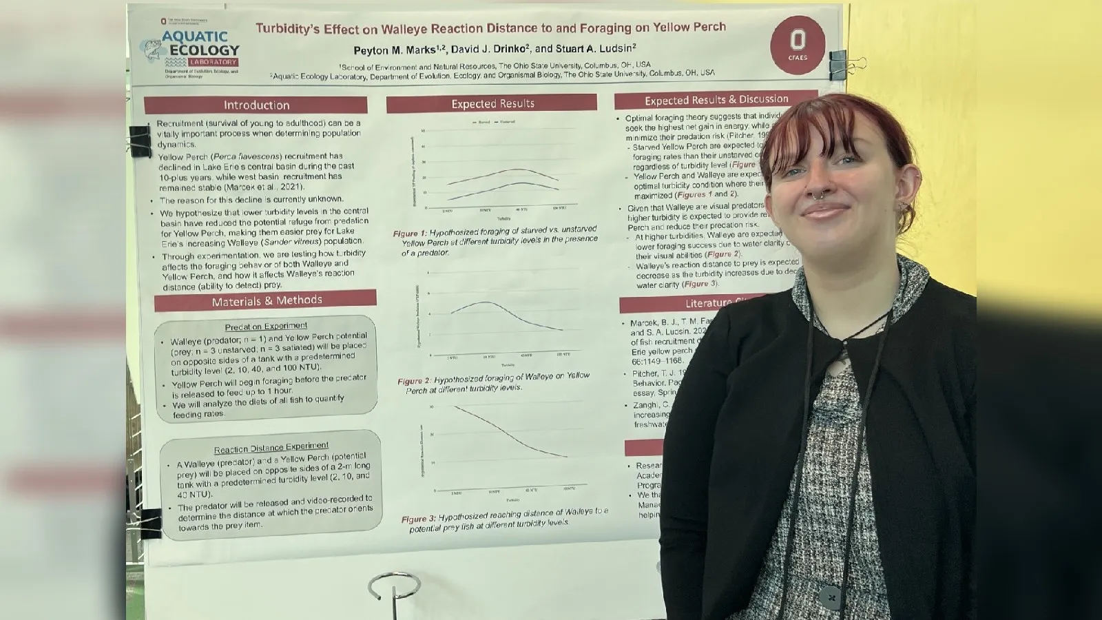 Peyton Marks standing next to her poster at the SROP Forum